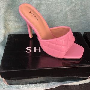 Pink stiletto heeled mules